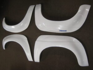 MGB FIBREGLASS 4 PIECE FLARED WHEEL ARCH ONLY SET SEBRING