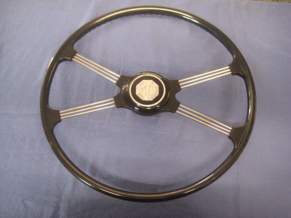 MGA ORIGIONAL STYLE SPOKED STEERING WHEEL AND BADGE AHH6003/4